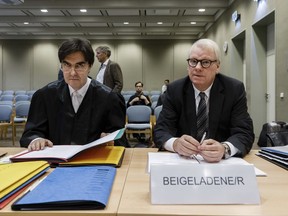 The attorney of the Aldi family, Emil Huber, right, and his counsel Thomas Mayer sitting in a court room of the state of Schleswig-Holstein's Higher Administrative Court in Schleswig, Germany, Thursday, Nov. 23,  2017. A court is expected to rule Thursday in a case that has exposed a rift within Germany's secretive Albrecht family, owners of the discount supermarket chain Aldi. The company is split into two geographical parts and the dispute centers on the control over Aldi Nord, which operates in northern Germany, Poland, Denmark, France, the Benelux countries and the Iberian peninsula.  (Markus Scholz/dpa via AP)