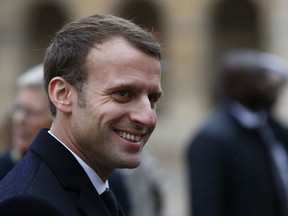 France's President Emmanuel Macron attends an award ceremony in the courtyard of the Invalides , in Paris, Monday, Nov. 27, 2017. (AP Photo/Thibault Camus, Pool)