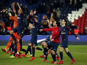PSG players celebrate at the end of their League One soccer match against Nantes, at the Parc des Princes stadium in Paris, France, Saturday, Nov.18, 2017. (AP Photo/Thibault Camus)
