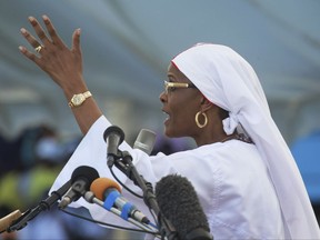 FILE - In this Sunday, Nov. 5, 2017 file photo, Zimbabwe's first lady Grace Mugabe addresses church leaders at a gathering in Harare. Mugabe has moved a dramatic step closer to succeeding her husband as leader. The increasingly outspoken Grace Mugabe, who has survived a number of scandals, is now poised to become one of the country's two vice presidents. (AP Photo/Tsvangirayi Mukwazhi, File)