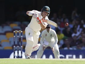 Australia's David Warner plays a shot against England during their Ashes cricket test in Brisbane, Australia, Sunday, Nov. 26, 2017. (AP Photo/Tertius Pickard)