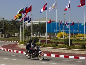 Flags of the member countries flutter on a roundabout ahead of the Asia Europe Foreign Ministers Meeting (ASEM) Sunday, Nov. 19, 2017, in Naypyitaw, Myanmar. The 13th Asia Europe Foreign Ministers Meeting (ASEM) will held in the capital Naypyitaw from Nov. 20 to Nov. 21, 2017. (AP Photo/Thein Zaw)