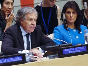 United Nations U.S. Ambassador Nikki Haley, right, listens as Organization of American States Secretary General Luis Almargo speaks during a U.N. meeting on human rights concerns in Venezuela, Monday Nov. 13, 2017 at U.N. headquarters. (AP Photo/Bebeto Matthews)