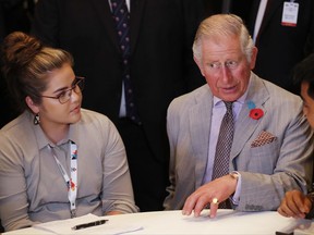 Britain's Prince Charles talks with young adults during the Commonwealth Youth Summit at University of Nottingham Malaysia Campus in Semenyh, on the outskirts of Kuala Lumpur, Malaysia, Friday, Nov. 3, 2017. Prince Charles and his wife, Camilla, arrived in Malaysia for the second stop of an 11-day trip to strengthen ties between Britain and Asian countries. (AP Photo/Vincent Thian)