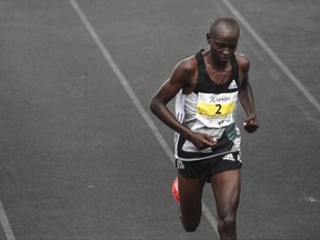 Kenya's Milton Rotich finishes in the second place at the 35th Athens Marathon at Panathenaikon stadium in Athens, Sunday, Nov. 12, 2017. Kalalei has won the Athens Marathon, beating compatriot Milton Rotich by just over two minutes. (AP Photo/Yorgos Karahalis)