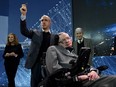 Internet investor Yuri Milner, left, holds up a Star Chip probe with renowned cosmologist Professor Stephen Hawking during a press conference at One World Observatory on April 12, 2016 in New York.