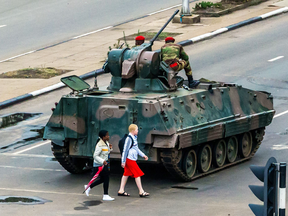 The signs of takeover were evident on the streets of Harare in the hours after what may have been a bloodless coup.