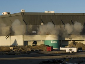 Detonations can be seen during an attempted implosion of the Silverdome, in Pontiac, Michigan on Dec. 3, 2017. Technical problems with the explosives left the stadium still standing after the blast.