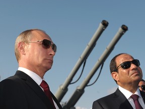 In this file photo taken on Tuesday, Aug. 12, 2014, Russian President Vladimir Putin, left, and Egyptian President Abdel-Fattah el-Sisi, visit missile cruiser Moskva ( Moscow) in the Russian Black Sea resort of Sochi, Russia.