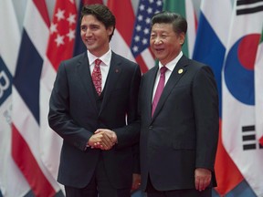 Canadian Prime Minister Justin Trudeau is greeted by Chinese President Xi Jinping during the official welcome at the G20 Leaders Summit in Hangzhou on September 4, 2016.