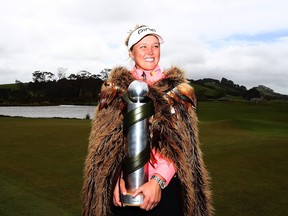 Brooke Henderson poses with the New Zealand Women's Open trophy in Auckland on Oct. 2.
