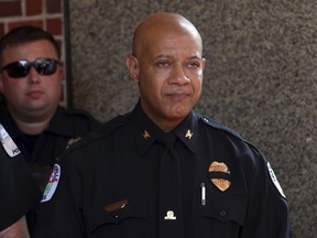 In a Wednesday, Aug. 16, 2017 file photo, Charlottesville Police Chief Al S. Thomas Jr. exits the memorial service for Heather Heyer, at the Paramount Theater in Charlottesville, Va.