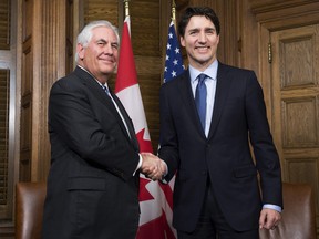 Prime Minister Justin Trudeau shakes hands with  US Secretary of State Rex Tillerson at the start of a meeting on Parliament Hill in Ottawa, Tuesday, December 19, 2017.