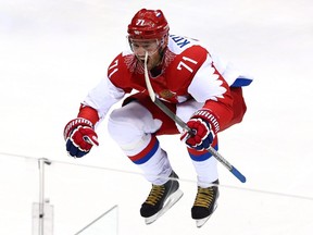 In this Feb. 19, 2014 file photo, Russian forward Ilya Kovalchuk celebrates a goal he scored against Finland at the Sochi Olympics.