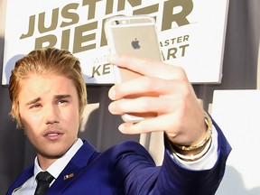 Justin Bieber takes a selfie with fans at The Comedy Central Roast of Justin Bieber at Sony Pictures Studios on March 14, 2015 in Los Angeles, California.