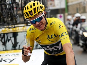 In this July 23, 2017 file photo, Chris Froome celebrates his fourth career victory in the Tour de France.
