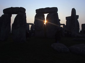 The sun rises over Stonehenge as druids celebrate the Spring Equinox at Stonehenge on March 20 2009 near Amesbury, Wiltshire, England.