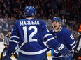 Toronto Maple Leafs forward Patrick Marleau (left) celebrates his overtime winner against the Boston Bruins with teammate Mitch Marner on Nov. 10.