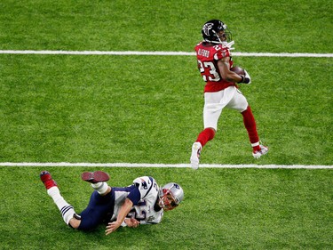 Atlanta Falcons DB Robert Alford sprints past New England Patriots QB Tom Brady for a touchdown in the Super Bowl on Feb. 5.