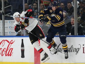 Rasmus Ristolainen of the Sabres checks Dion Phaneuf of the Ottawa Senators during the third period at the KeyBank Center in Buffalo on Tuesday night.