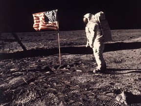 A July 20, 1969 photo from files made showing astronaut Buzz Aldrin posing for a photograph beside the U.S. flag deployed on the moon during the Apollo 11 mission.