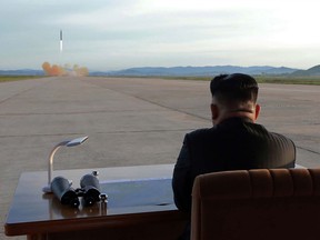 This undated picture released from North Korea's official Korean Central News Agency on Sept. 16, 2017 shows North Korean leader Kim Jong-Un inspecting a launching drill of the medium-and-long-range strategic ballistic rocket Hwasong-12 at an undisclosed location.