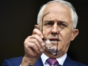 Australia's Prime Minister Malcolm Turnbull attends a press conference at Parliament House in Canberra, Tuesday, Dec. 5, 2017. Australia will ban foreign interference in its politics, motivated largely by Russia's alleged involvement in last year's U.S. election and China's growing influence on world politics.