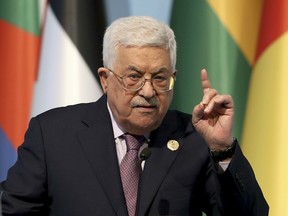 Palestinian President Mahmoud Abbas gestures as he talks during the closing news conference following the Organisation of Islamic Cooperation's Extraordinary Summit in Istanbul, Wednesday, Dec. 13, 2017.