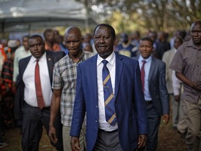 FILE - In this Tuesday, Oct. 31, 2017 file photo, Kenya's opposition leader Raila Odinga leaves after making his first public statement to the media after President Uhuru Kenyatta was declared the winner of the Oct. 26 election, in Nairobi, Kenya. A privacy watchdog said Thursday, Dec. 14, 2017 that Kenya's opposition leader Raila Odinga was targeted by a virulent online campaign created by a Texas-based company during the recent election turmoil.