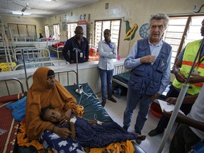 U.N. refugee chief Filippo Grandi, center-right, visits a hospital as he tours Dadaab refugee camp, which currently hosts over 230,000 inhabitants, in northern Kenya Tuesday, Dec. 19, 2017. Grandi said Tuesday that the world must do more to help millions of refugees across sub-Saharan Africa, which hosts more than a quarter of the world's refugees.