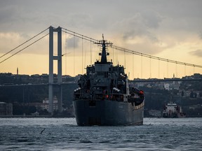 This photo taken on October 18, 2016 shows the Russian war ship BSF Nikolay Flichenkov 152 passing through the Bosphorus Strait, on it's way to eastern Mediterranean port of Tartus, on October 18, 2016 in Istanbul.