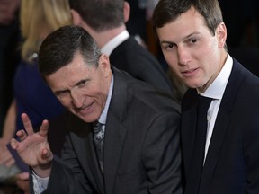 This file photo taken on February 13, 2017 shows then National Security Advisor Michael Flynn (L) and Jared Kushner, senior White House adviser, before a joint press conference between Canada's Prime Minister Justin Trudeau and US President Donald Trump in the East Room of the White House in Washington, DC.
