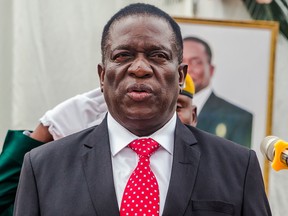 Zimbabwe's new President Emmerson Mnangagwa presides over a swearing in ceremony as his new cabinet took office on December 4, 2017 at State House in Harare.