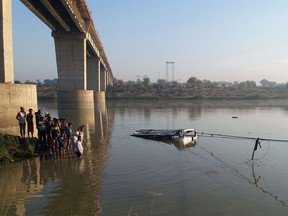 An Indian bus is pulled from the Banas River after a deadly accident in Sawai Madhopur, some 160 kilometres (100 miles) from Jaipur in Rajasthan state, on December 23, 2017.