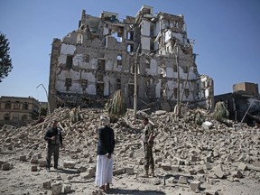 Houthi Shiite rebels inspect the rubble of the Republican Palace that was destroyed by Saudi-led airstrikes, in Sanaa, Yemen, Wednesday, Dec. 6, 2017. Former President Ali Abdullah Saleh was killed on Monday by his onetime allies, the Iran-backed Houthis. Sanaa has witnessed heavy fighting since last week between Saleh's loyalists and Houthis forcing many Yemenis to cower indoors fearing the violent street clashes.