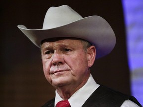 In this Monday, Sept. 25, 2017, file photo, former Alabama Chief Justice and U.S. Senate candidate Roy Moore speaks at a rally, in Fairhope, Ala. In the face of sexual misconduct allegations, Moore's U.S. Senate campaign has been punctuated by tense moments and long stretches without public appearances. Moore faces Democrat Doug Jones for Alabama's U.S. Senate seat in the Dec. 12 election.
