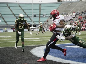 Texas Tech wide receiver Keke Coutee (2) catches a touchdown pass as South Florida cornerback Mazzi Wilkins (23) attempt to stop him during the Birmingham Bowl NCAA college football game, Saturday, Dec. 23, 2017 in Birmingham, Ala.