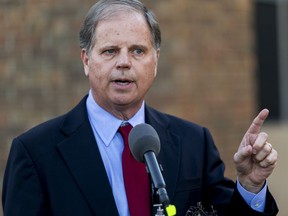 FILE - In this Nov. 28, 2017, file photo, Alabama U.S. Senatorial candidate Doug Jones talks with the media after touring the Northport Medical Center, in Northport, Ala. Jones is the democratic candidate facing republican Roy Moore for Alabama's U.S. Senate seat in the Dec. 12 special election.