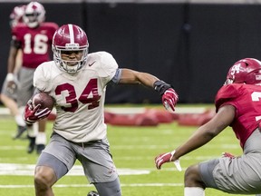Alabama running back Damien Harris (34) works through drills at NCAA college football practice for the Sugar Bowl against Clemson, Thursday, Dec. 28, 2017, in New Orleans, La.