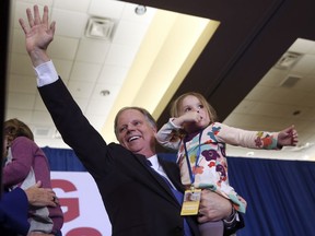 Doug Jones waves to supporters before speaking during an election-night watch party Tuesday, Dec. 12, 2017, in Birmingham, Ala. Jones won election to the U.S. Senate from Alabama, dealing a political blow to President Donald Trump.