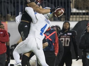 Middle Tennessee defensive back O.J. Johnson (4) breaks up a pass intended for Arkansas State wide receiver Justin McInnis (18) during first-half action at the Camellia Bowl NCAA college football game in Montgomery, Ala., Saturday, Dec. 16, 2017.
