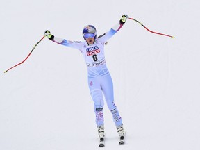 United States' Lindsey Vonn celebrates as she crosses the finish line of an alpine ski, women's World Cup super-G, in Val d'Isere, France, Saturday, Dec. 16, 2017.
