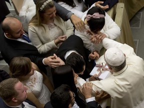 Pope Francis meets just married couples at the end of his weekly general audience in the Paul VI Hall at the Vatican, Wednesday, Dec. 20, 2017.