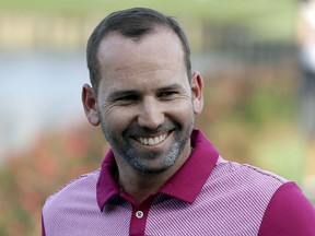 FILE - In this Thursday,, May 11, 2017 file photo, Sergio Garcia, of Spain, smiles as he walks to the 17th green after hitting a home-in-one during the first round of The Players Championship golf tournament in Ponte Vedra Beach, Fla. Garcia has been voted as the European Tour's golfer of the year after claiming his first major title at the Masters and winning two more events in 2017.