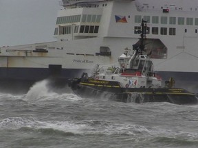 In this grab taken from video, a tug boat tries to tow The Pride of Kent ferry, in Calais, France, Sunday, Dec. 10, 2017.  Authorities prepared the emergency evacuation of a ferry carrying 313 people that ran aground at the French port city of Calais Sunday interrupting boat traffic across the English Channel, according to authorities. (AP)