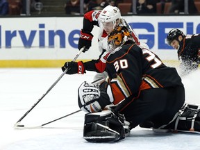 Anaheim Ducks goalie Ryan Miller (30) stops a shot by Ottawa Senators left wing Ryan Dzingel (18) during the first period of an NHL hockey game in Anaheim, Calif., Wednesday, Dec. 6, 2017.