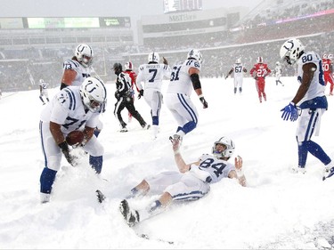 Indianapolis Colts tight end Jack Doyle, center, celebrates in the end zone during the second half of an NFL football game against the Buffalo Bills, Sunday, Dec. 10, 2017, in Orchard Park, N.Y. (AP Photo/Jeffrey T. Barnes)