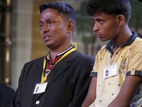 A Rohingya Muslim refugee, left, breaks down after meeting Pope Francis at an interfaith peace meeting in Dhaka, Bangladesh, Friday, Dec. 1, 2017. Pope Francis greeted and blessed Rohingya Muslim refugees who fled to Bangladesh from neighboring Myanmar, grasping their hands and listening to their stories at an interfaith peace prayer in Dhaka.