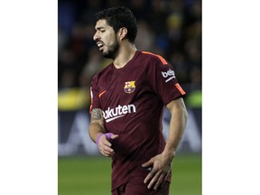 Barcelona's Luis Suarez reacts after failing to score against Villarreal during the Spanish La Liga soccer match between Villarreal and FC Barcelona at the Ceramica stadium in Villarreal, Spain, Sunday, Dec. 10, 2017.