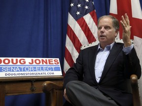 In this photo taken Wednesday, Dec, 13, 2017, Democrat Doug Jones speaks during an interview with the Associated Press, in Birmingham, Ala. Jones said he knew he had a path to victory. He said his win signals that voters are looking for a less vitriolic political rhetoric and vanquished the idea that a Democrat could not win in Alabama.